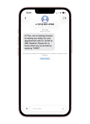 A text message asking a patient to reply HERE to check in for their appointment